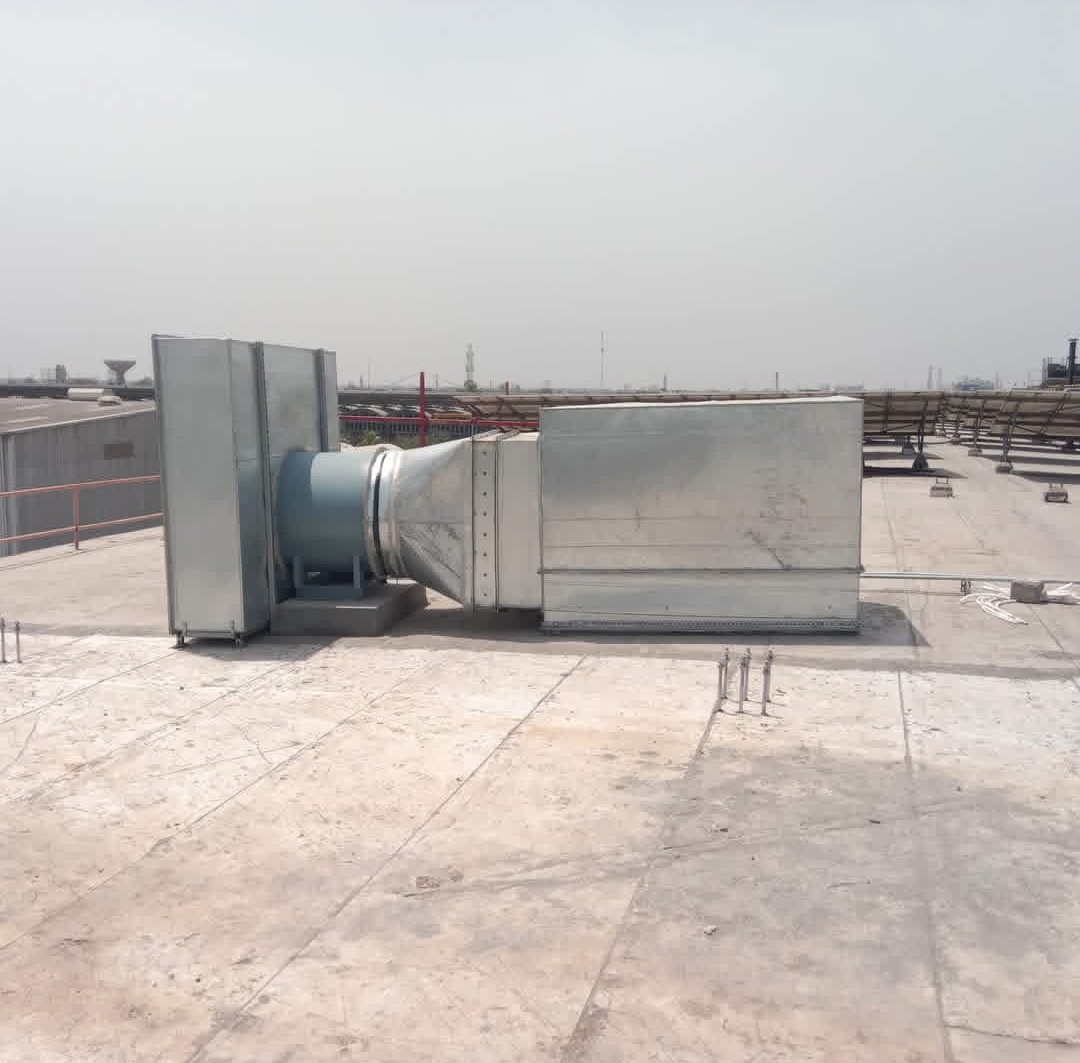 Rooftop ventilation fan connected to ductwork